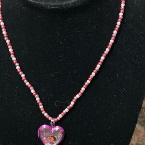 Pink and white beaded necklace with Dora the Explorer locket